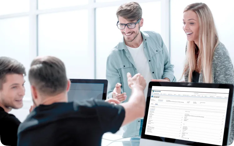 people in a meeting with computers