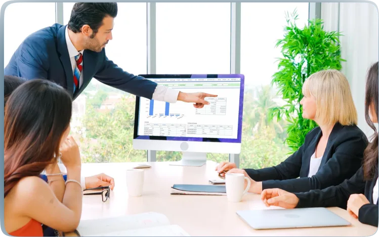 person pointing to the data on the screen